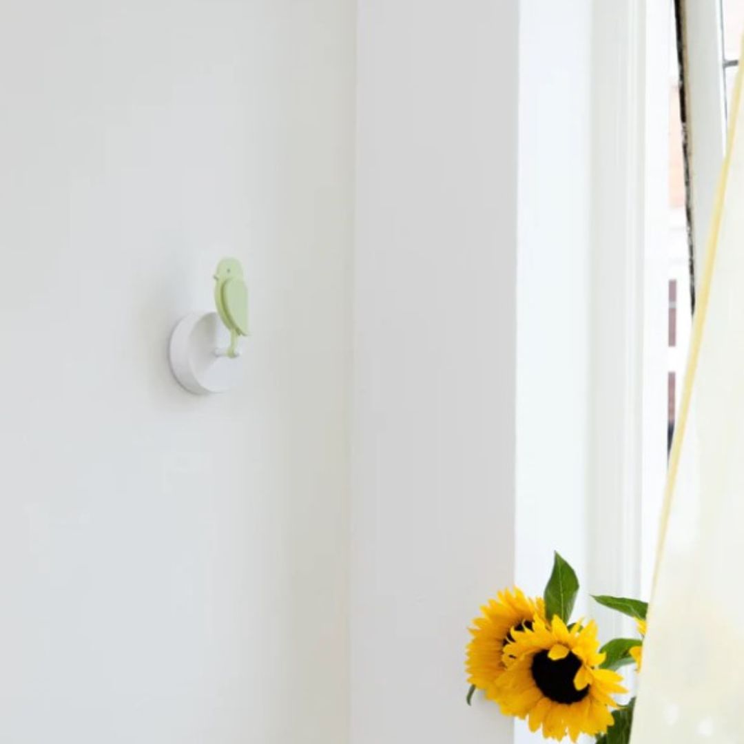 Birdie 2.0 indoor air quality monitor in Meadow green mounted on wall