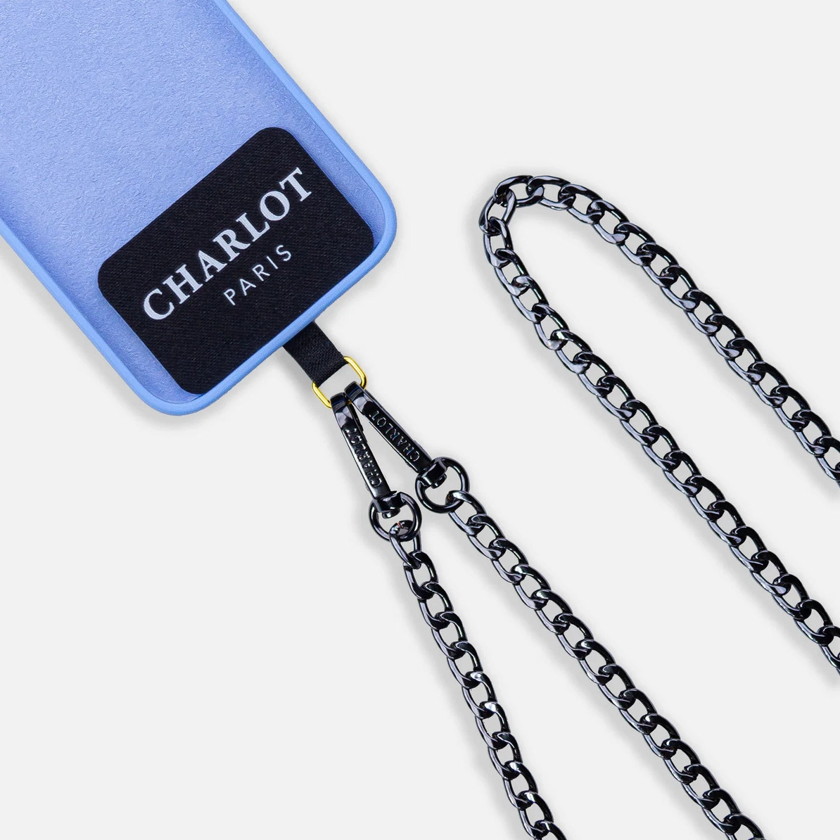 Attach your Charlot Paris strap to your own phone case with this strong phone strap adapter. Subtle, secure, and stylish.