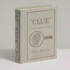 Elegant Clue Vintage Edition board game styled as a linen-bound book, with 1949-inspired graphics, metal weapons, wood tokens, and vintage clue cards.