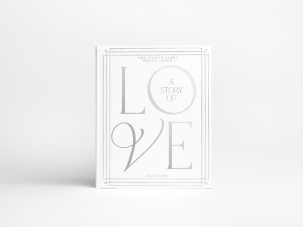 Wedding photo album with white cloth cover and silver foil text