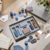 Luxury designer poker set in minimalist grey box with playing cards and chips