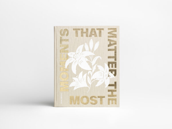 Beige coffee table photo album with gold foil text