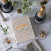 Champagne gift set in beige and orange book-style box with stainless steel opener and stopper – stylish gift