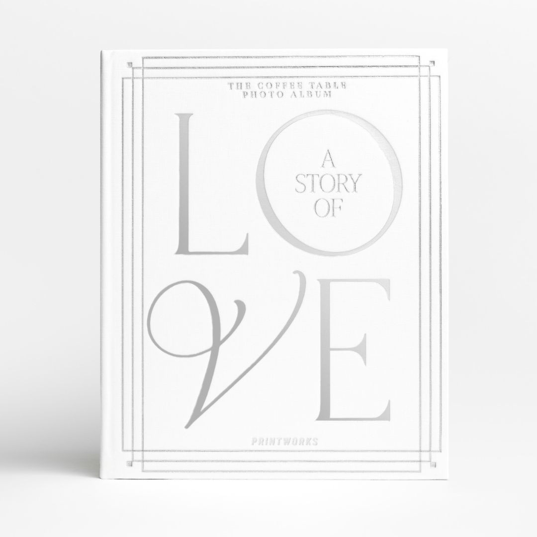 Wedding photo album with white cloth cover and silver foil text
