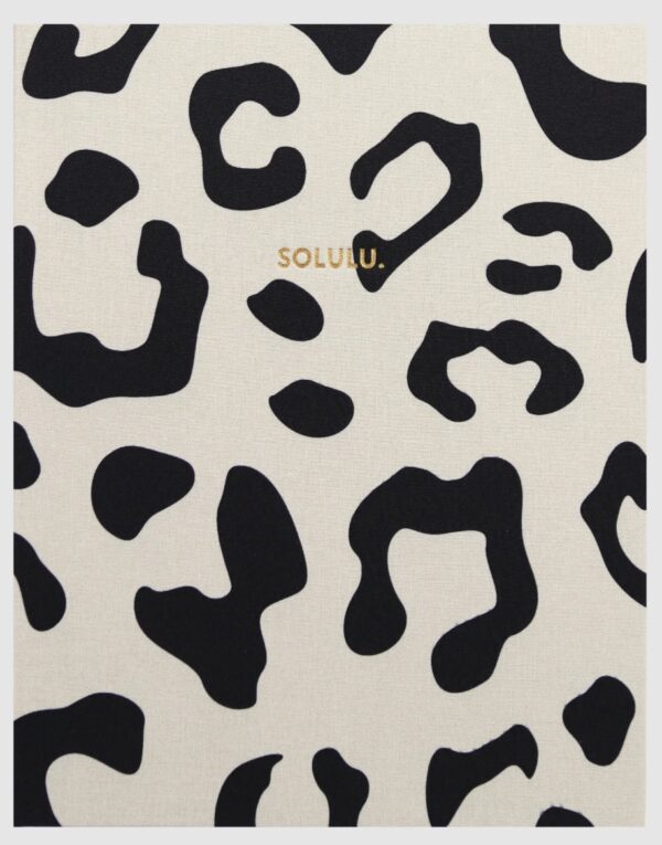 Leopard coffee table storage book by Solulu with beige linen cover, black leopard print, and gold logo
