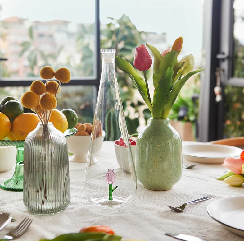 tulip bottle from Balvi on a set table