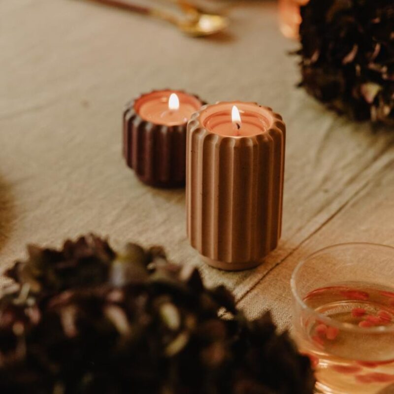 A warm candle holder in a mocha shade. The Dentelles tall design adds height and a cosy glow to any interior.