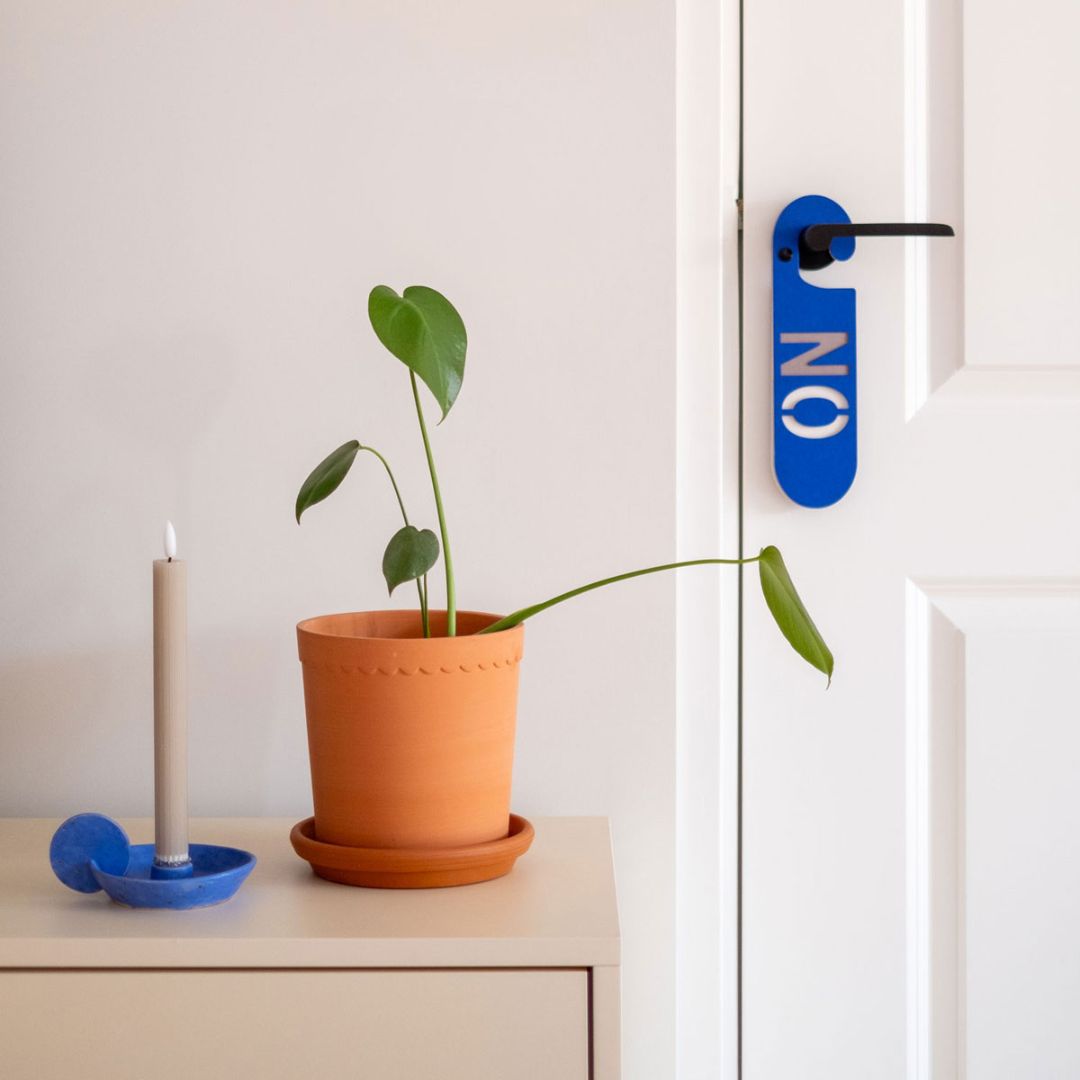 Black and blue YES NO colorful door hanger made from sustainable cardboard