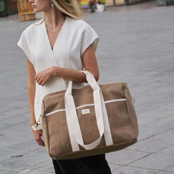 Brown weekend bag in aged cotton with leather-look finish and adjustable strap