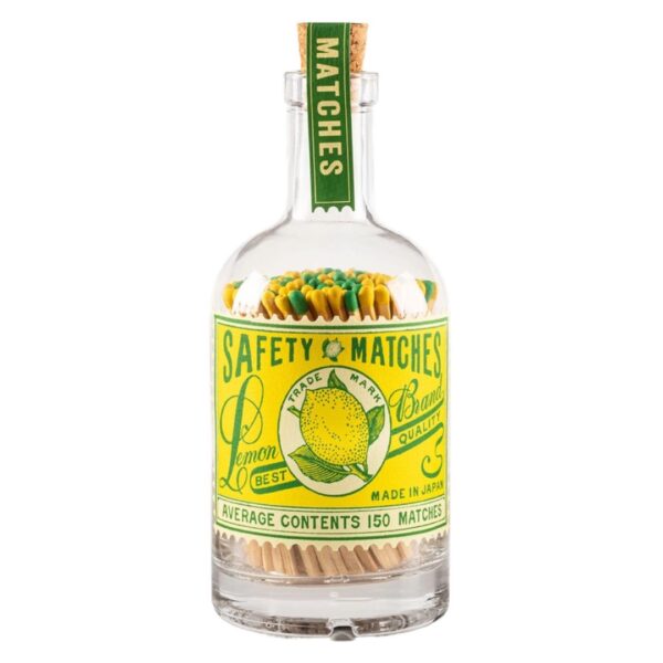 Glass bottle with lemon stamp label filled with colourful candle matches