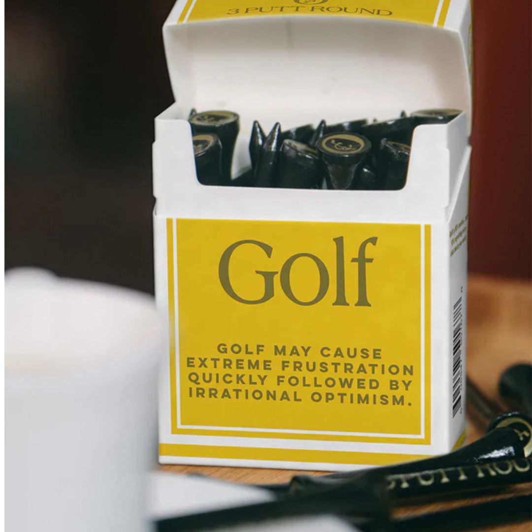 A gold golf tees pack with attitude — compact, playful and made for those who take their game (and style) seriously.