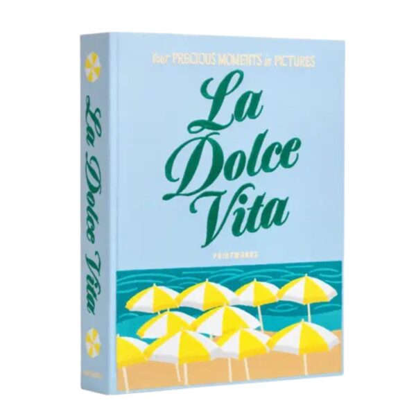 Printworks Dolce Vita embroidered photo album with blue cotton cover and colourful stitching displayed on a coffee table