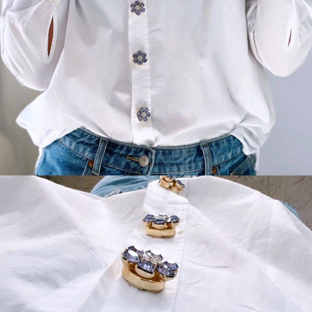 Named after the founder’s oma Hildegard, Hilde combines softness, elegance and personality in one refined accessory. Unlike traditional brooches or pins, these button charms simply click onto existing buttons up to 13 mm wide. No sewing and no permanent changes — just an effortless way to elevate shirts, blazers, cardigans or jackets within seconds. And honestly? They feel less like accessories and more like jewellery for your clothes.