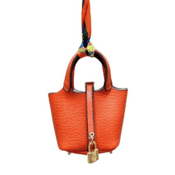 orange bag charm luxury handbag detail