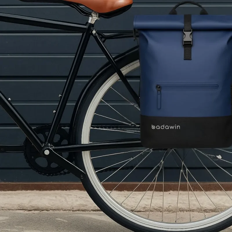 Blue bicycle pannier with hidden luggage rack attachments